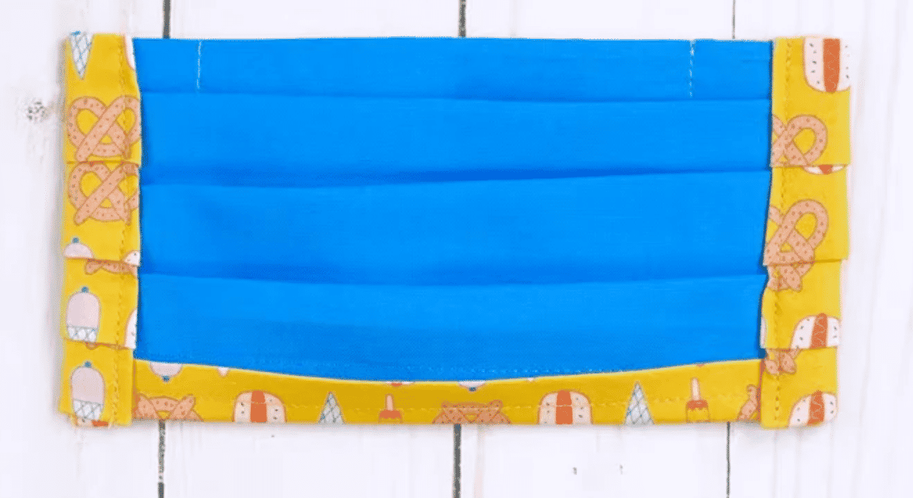 A blue and yellow flag attached to the wall Description automatically generated